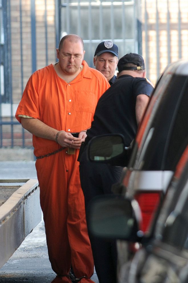 PHOTO: In this March 18, 2011 file photo Michael Carneal is escorted by a guard from the District Courthouse in Paducah, Ky.