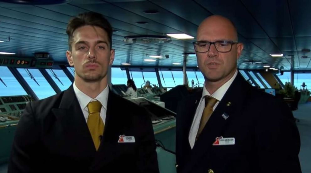 Carnival Glory Captain Pero Grubjesic and Safety Officer Cesare Mattera discuss the rescue of a crew member from a Norwegian cruise ship on Sunday, July 1, 2018. 