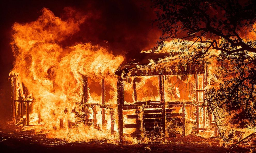 PHOTO: A structure burns as the Carr Fire races along Highway 299 near Redding, Calif., July 26, 2018.