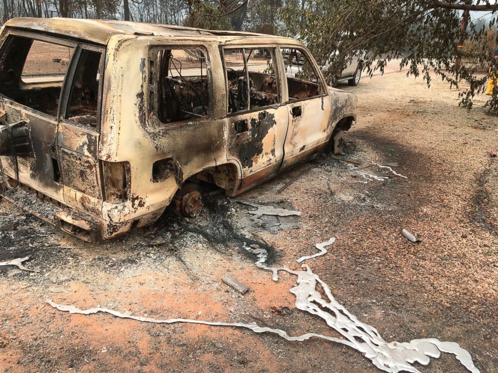A burned vehicle is seen in the mountain community of Keswick, Calif., Sunday, July 29, 2018. On Sunday, the San Bernardino County Fire department pulled in to tamp down smoking rubble. Piles of wreckage were still smoking amid downed electricity lines. 