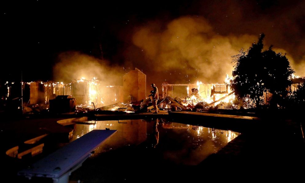 PHOTO: A home burns along Sunflower Road during the Carr Fire, July 27, 2018, in Redding, Calif.