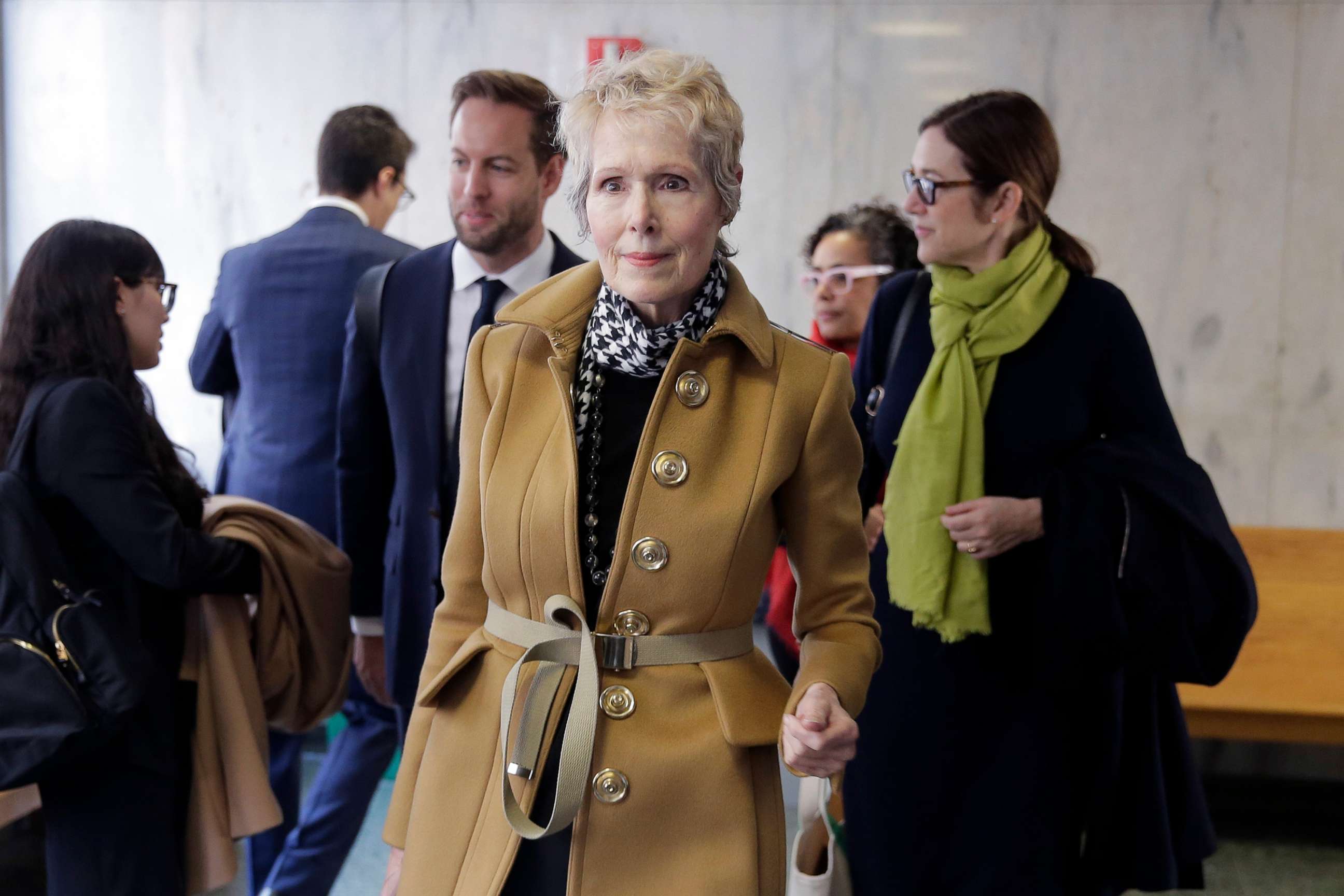 PHOTO: E. Jean Carroll, center, waits to enter a courtroom in New York, March 4, 2020.