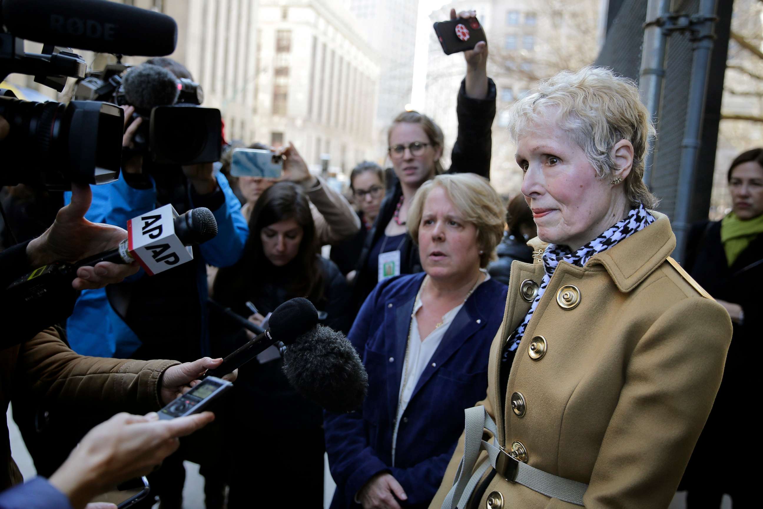 PHOTO: In this March 4, 2020 file photo E. Jean Carroll, right, talks to reporters outside a courthouse in New York.