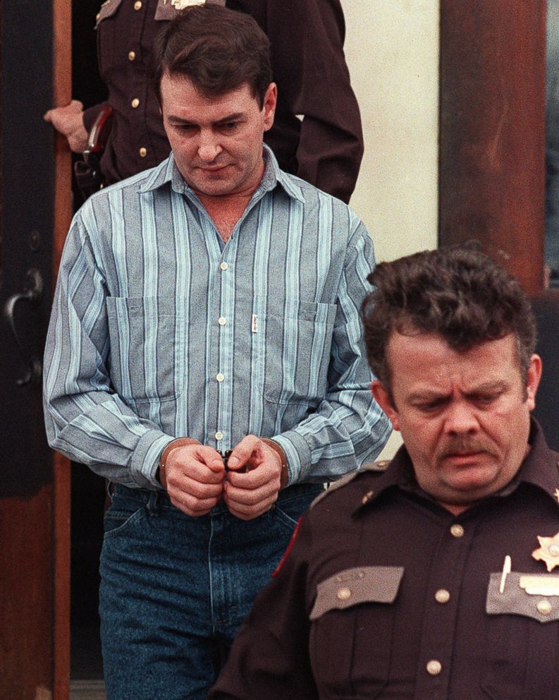 PHOTO: Larry Mahoney, left, is led from the Carroll County courthouse in Kentucky by Sheriff George "Ricky" Cayton after being sentenced to 16 years in prison, on Feb. 23, 1990 for causing the Carrollton bus crash in which 27 people died.
