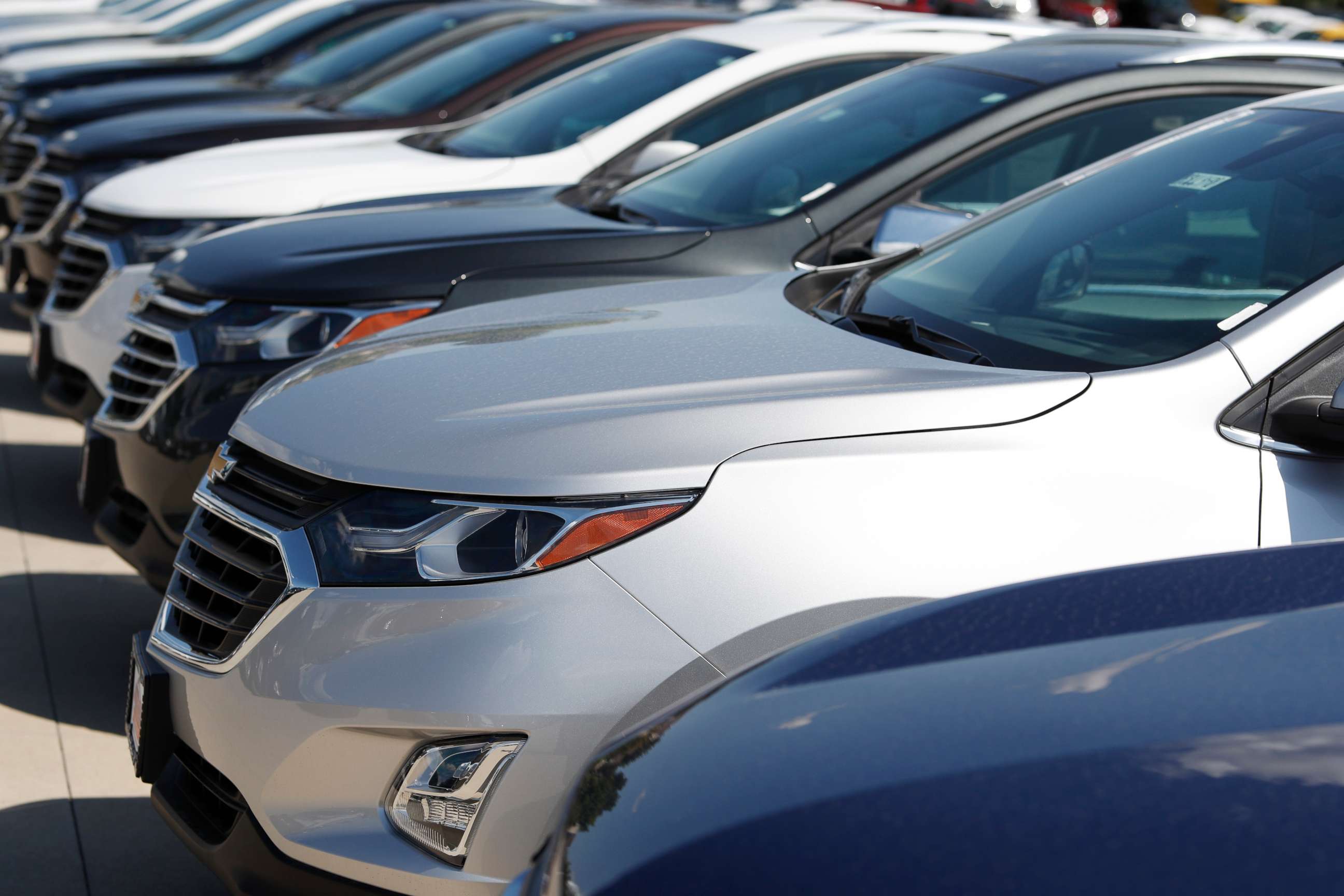 PHOTO: In this Sunday, July 28, 2019, file photograph, unsold 2019 Chevrolet Equinox sports utility vehicles sit at a dealership in Englewood, Colo.