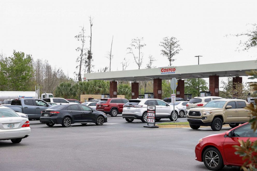 PHOTO: Cars wait in line at a Costco gas station on March 10, 2022, in Tampa, Fla.