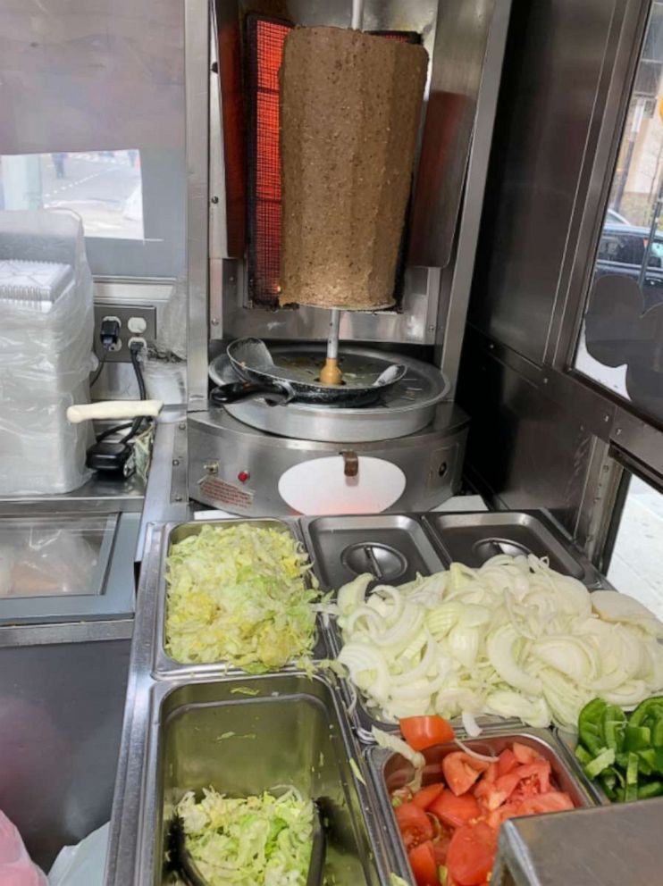 PHOTO: Inside the Halal cart on the corner of Wall Street and Water Street in downtown Manhattan, on April 16, 2022.
