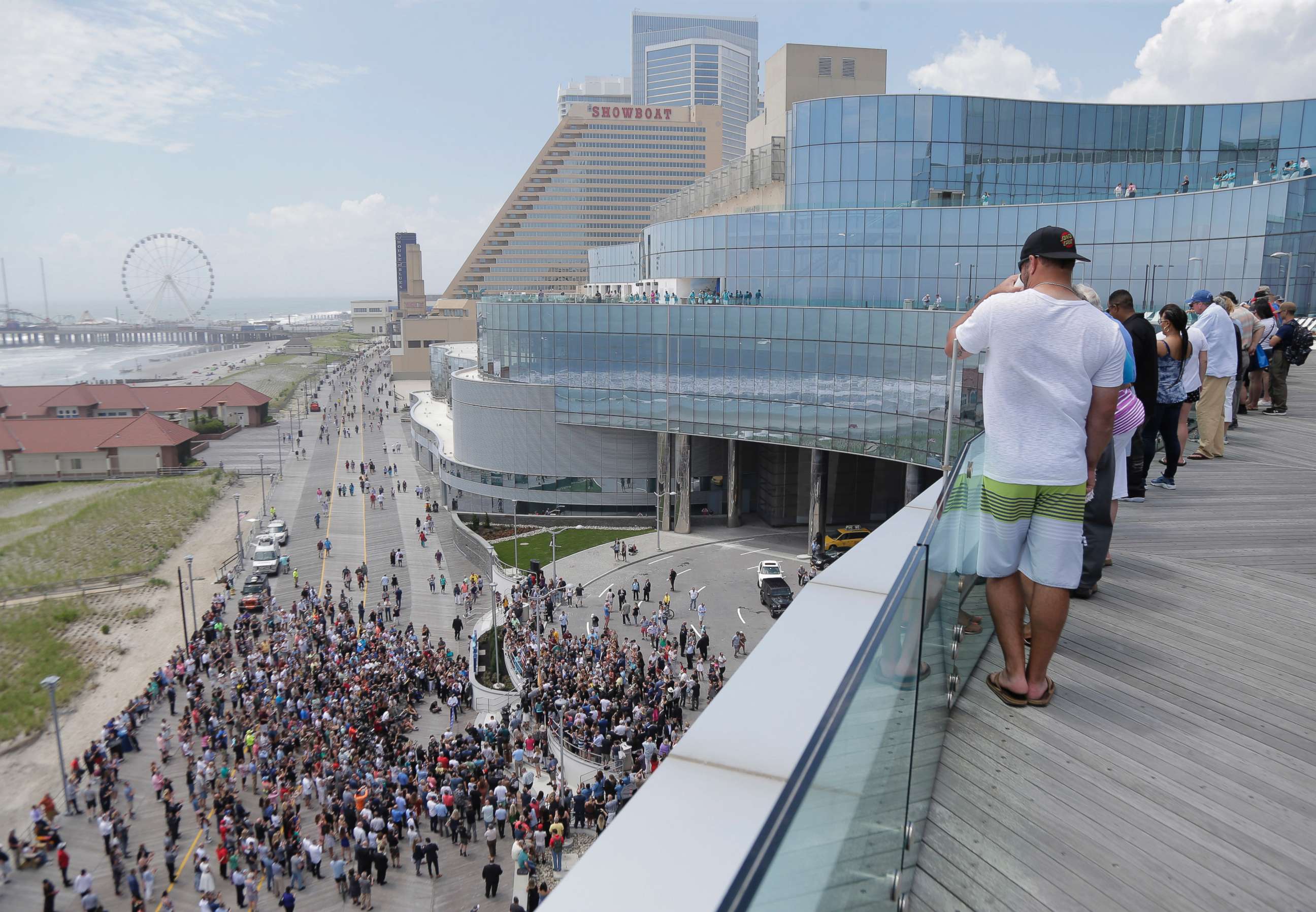 PHOTO: People gather on the boardwalk and the balconies to watch a ribbon cutting ceremony for the Ocean Resort Casino in Atlantic City, N.J., June 28, 2018.