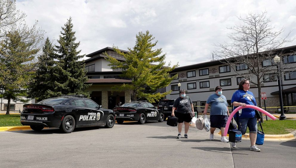 PHOTO: Guests leave the Oneida Casino/Radisson Hotel & Conference Center on Sunday morning, May 2, 2021, after a shooting took place on Saturday where three people were killed, including the gunman, and one person was seriously injured.