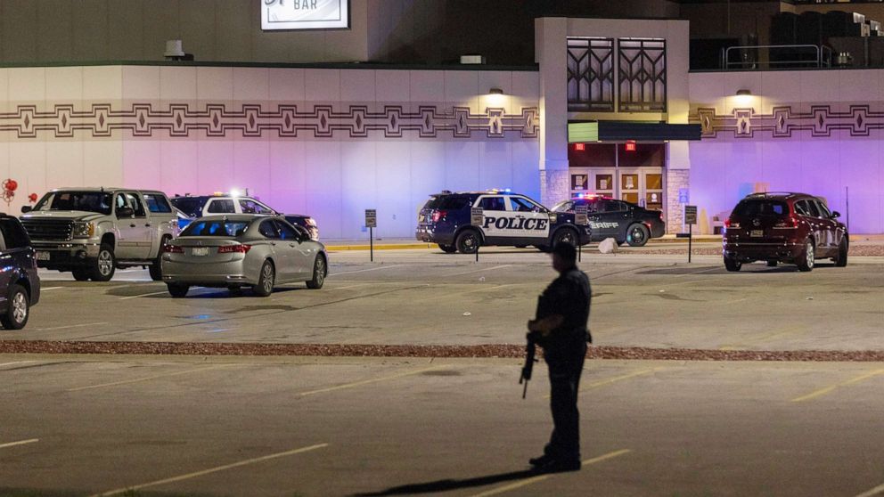 PHOTO: Police stand guard in the parking area outside the Oneida Casino in the early morning hours, May 2, 2021, near Green Bay, Wis., following a shooting that left three dead and seriously wounded another.