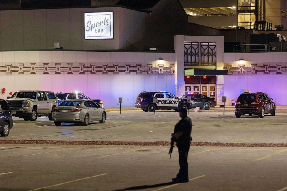 PHOTO: Police stand guard in the parking area outside the Oneida Casino in the early morning hours, May 2, 2021, near Green Bay, Wis., following a shooting that left three dead and seriously wounded another.