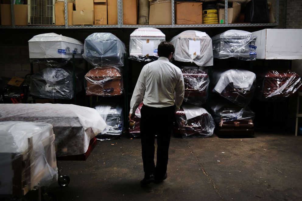 PHOTO: James Harvey tends tends to the inventory of pre-sold caskets at a funeral home on April 29, 2020 in New York City.