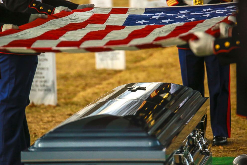 PHOTO: Marine Corps Body Bearers fold the National Ensign during a funeral for Master Sgt. Catherine G. Murray, ret., at Arlington National Cemetery, Jan. 23, 2018.