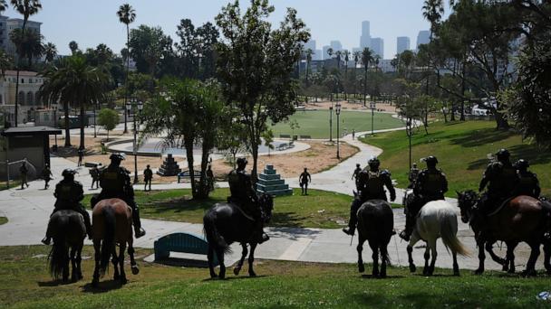 Federal agents ride on horseback at MacArthur Park, July 7, 2025, in Los Angeles. 