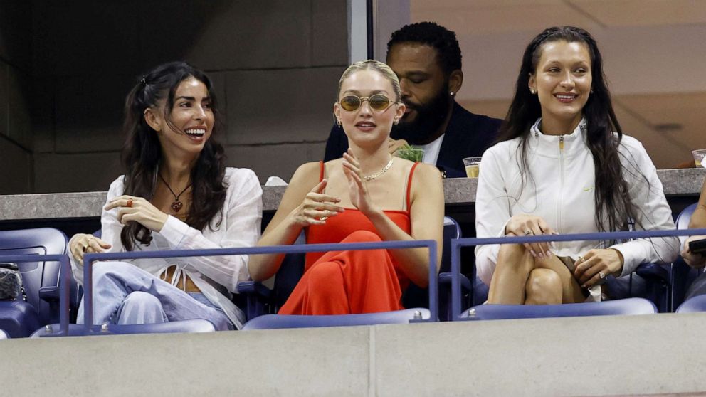PHOTO: Models Gigi and Bella Hadid (right) watch as Serena Williams plays against Anett Kontaveit during her the first set of her second-round match of the 2022 US Open Tennis Championships in New York, Aug. 31, 2022.