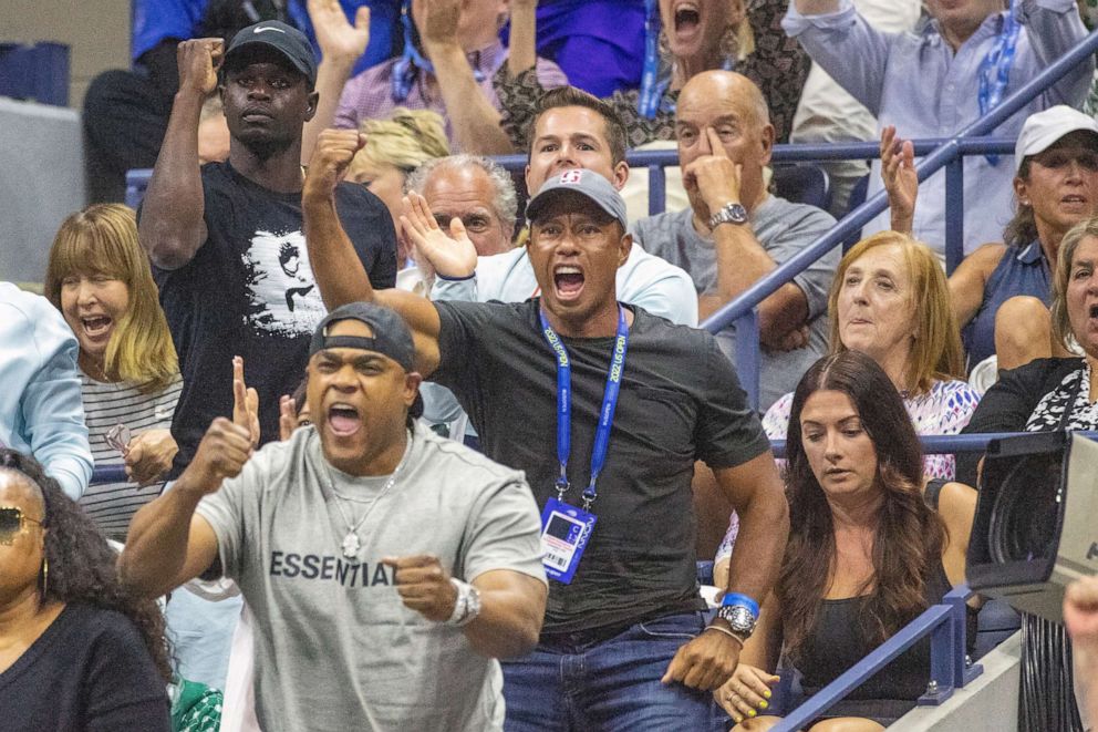 PHOTO: Tiger Woods reacts as Serena Williams of the United States wins the first set against Anett Kontaveit of Estonia on Arthur Ashe Stadium in the Women's Singles second round match during the US Open Tennis Championship in New York, Aug. 31, 2022.