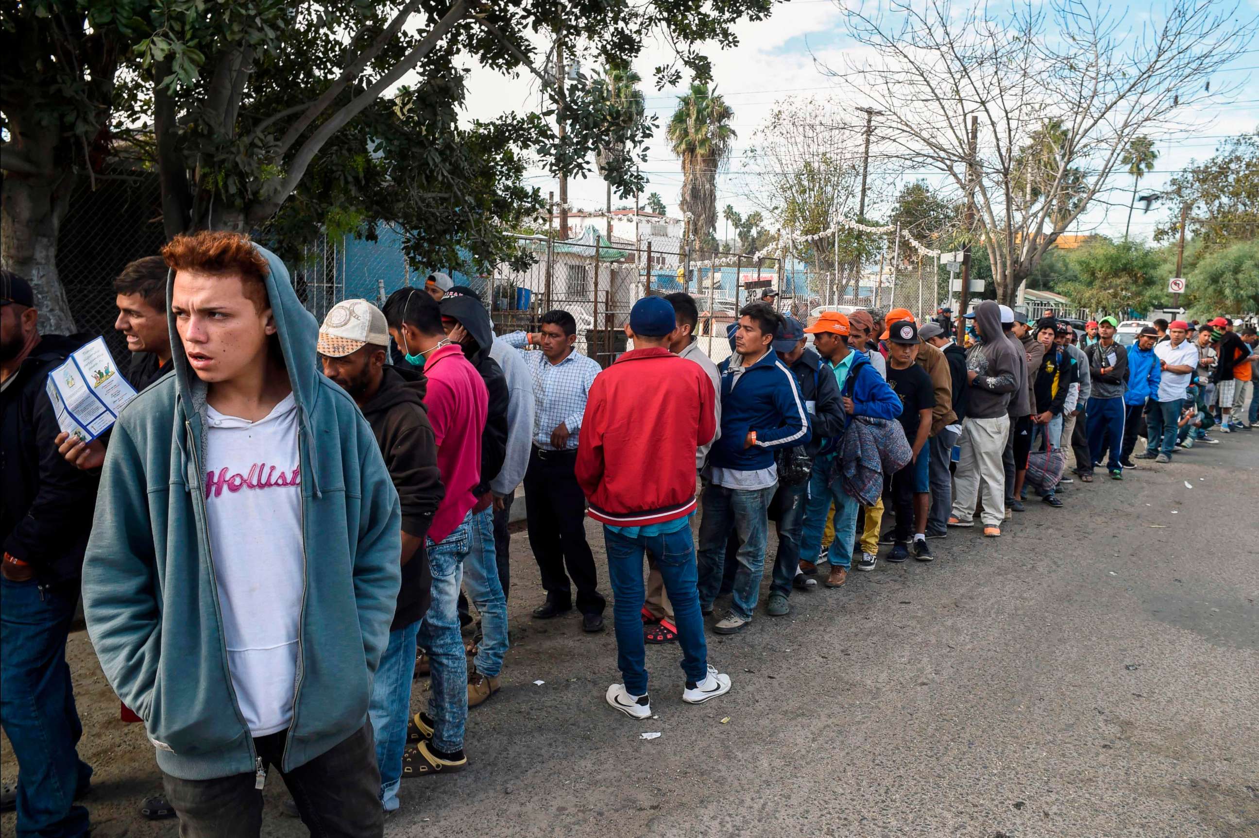 PHOTO: Central American migrants line up for food at a shelter in Playas de Tijuana, Mexico, Nov. 15, 2018.