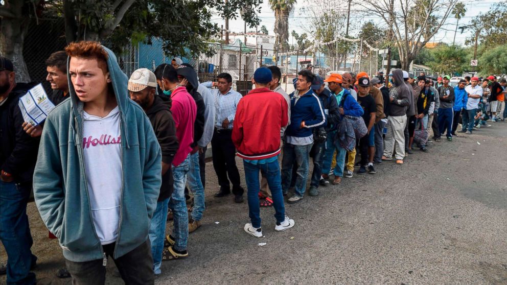 Central American migrants line up for food at a shelter in Playas de Tijuana, Mexico, Nov. 15, 2018.