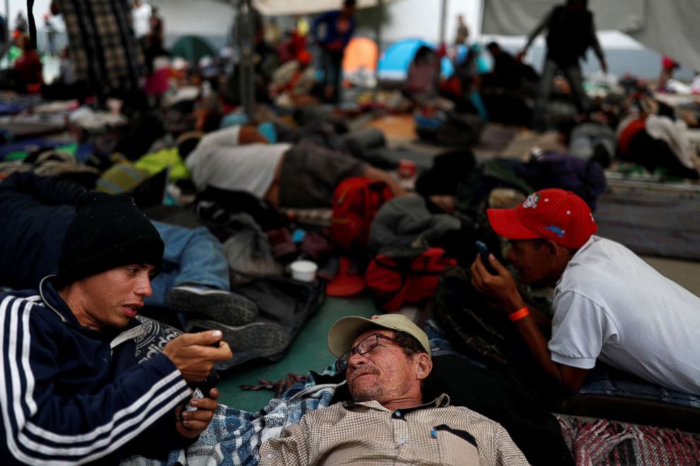 PHOTO: Migrants, part of a caravan traveling en route to the United States, rest in a sport center that is currently used as a temporary shelter in Tijuana, Mexico, Nov. 15, 2018.