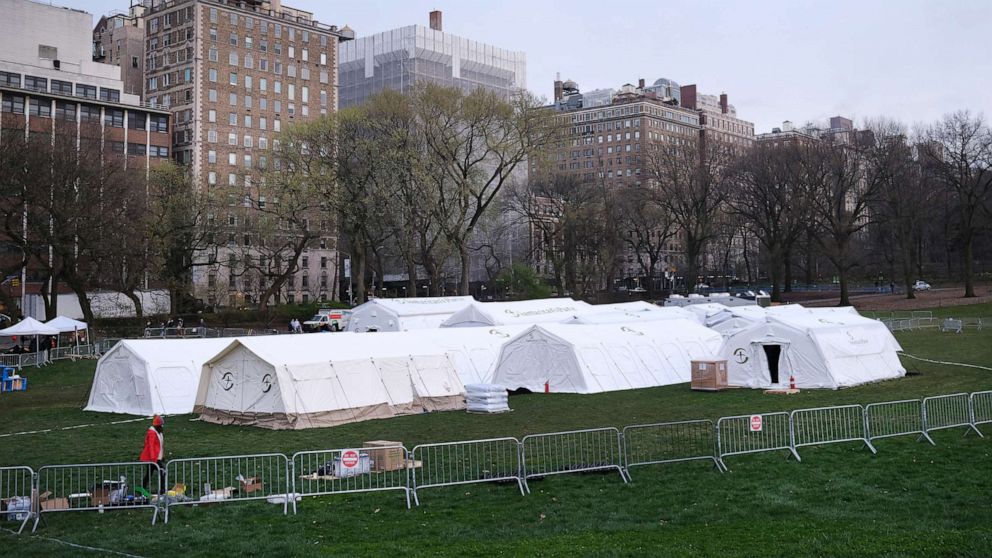 PHOTO: Members of the international Christian humanitarian organization Samaritans's Purse, put the finishing touches on a field hospital in New York's Central Park, March 30, 2020 in New York City.