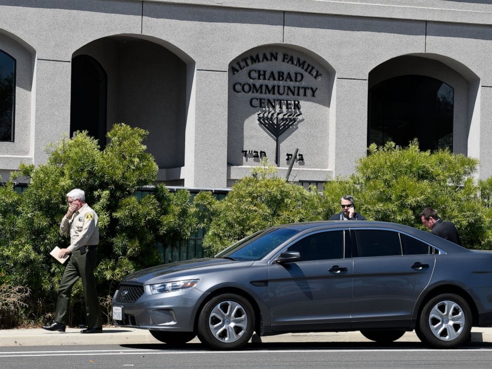 PHOTO: San Diego County Sheriff Bill Gore, left, walks past the Chabad of Poway Synagogue Saturday, April 27, 2019, in Poway, Calif. Several people were injured in a shooting at the synagogue.