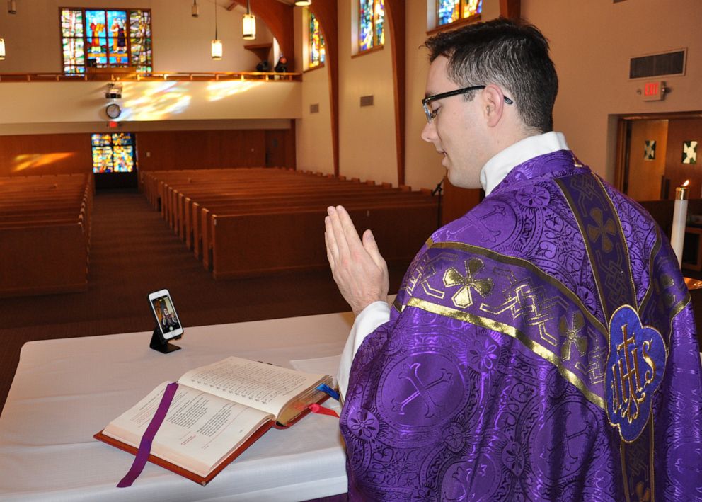 PHOTO: Chaplain 1st Lt. Philip O'Neill prepares for a virtual mass at Offutt Air Force Base, Neb.