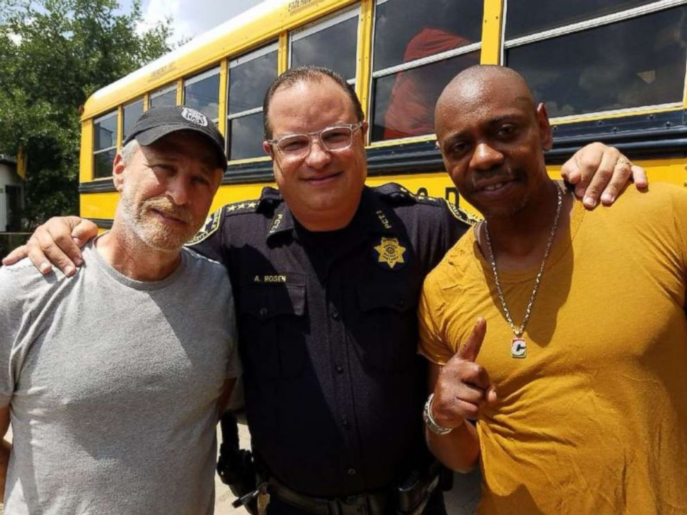 Comedians Jon Stewart and Dave Chappelle pose for a photo with Harris County Precinct 1 Constable Alan Rosen on Friday, June 22, 2018.