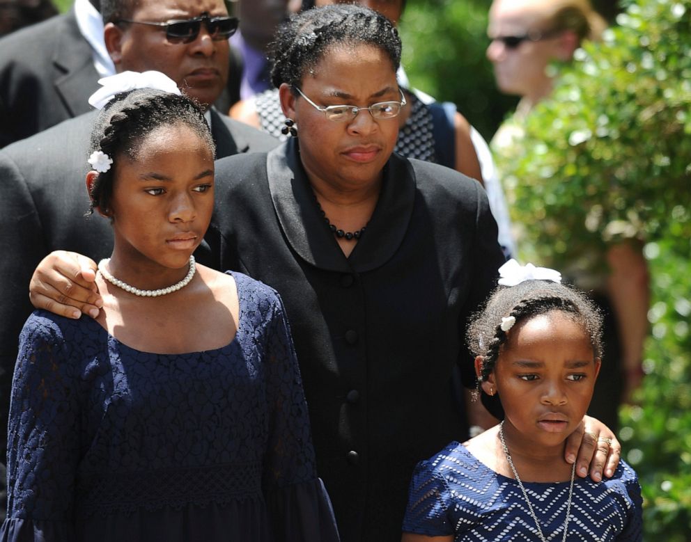 PHOTO: In this June 24, 2015, file photo Sen. Clementa Pinckney's wife Jennifer Pinckney, center, and her daughters, Eliana, left, and Malana, right, follow his casket into the South Carolina Statehouse in Columbia, S.C.