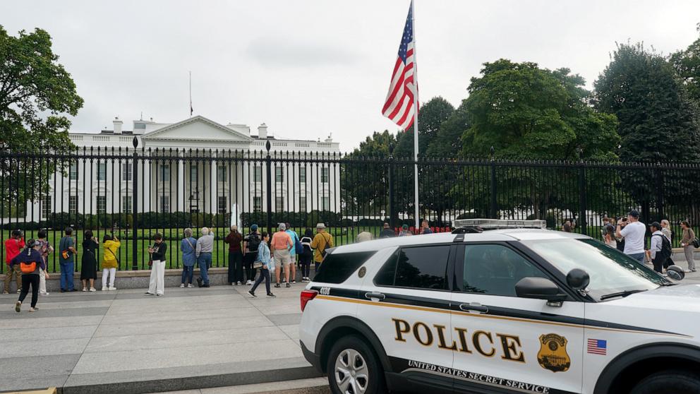 PHOTO: People gather in front of the White House, as a U.S. flag files at half mast, after right-wing activist Charlie Kirk was fatally shot at an event at Utah Valley University in Orem, Utah, in Washington, Sept. 10, 2025.  