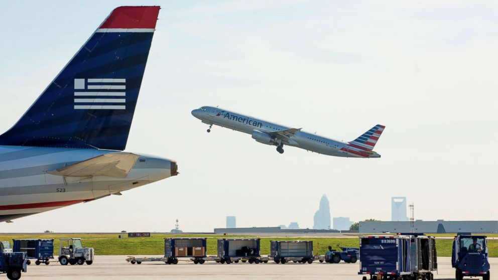 PHOTO: An American Airlines planes takes off as staff and employees at Charlotte Douglas International Airport in Charlotte, N.C. on Sept. 17, 2015.