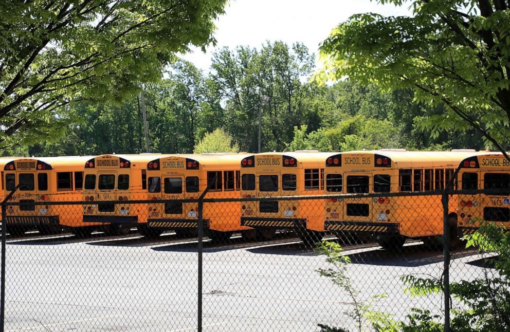 PHOTO: In this April 21, 2020, file photo, parked school buses sit in a lot in Charlotte, North Carolina