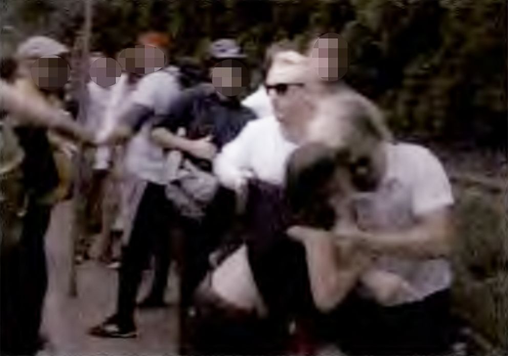 PHOTO: A video grab included in the charging documents allegedly shows Cole White headbutting a female counter protester with the assistance of  Benjamin Daley at the "Unite the Right" rally in Charlottesville, Va., in 2017.