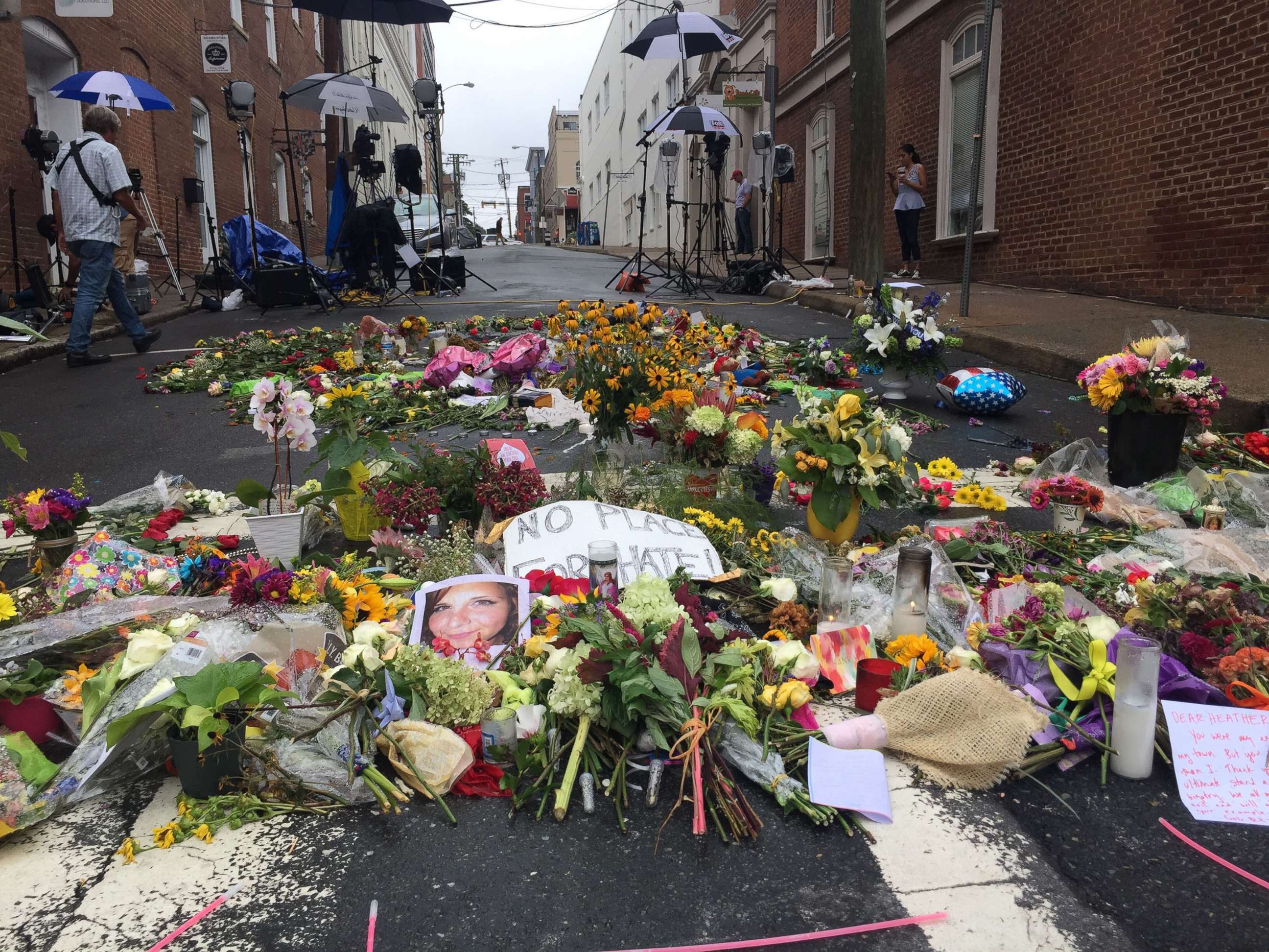 PHOTO: lowers are left in the street creating a make-shift memorial for Heather Heyer, who was killed during the 2017 protests in Charlottesville, Va.