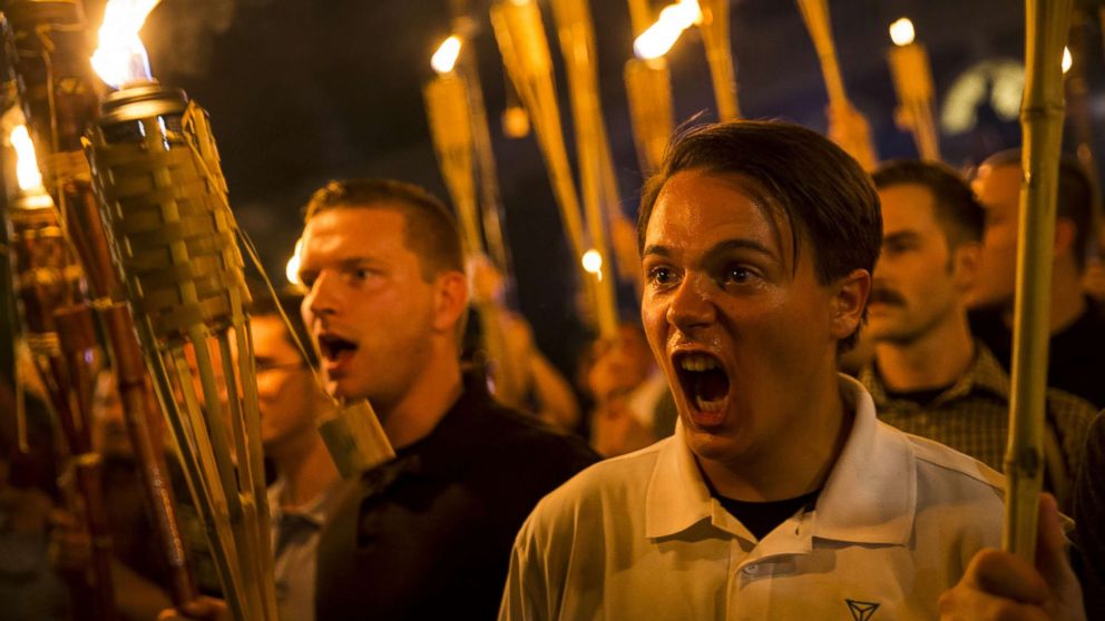 PHOTO: A group primarily composed of self-identified Neo Nazis, Alt-Right and White Supremacists chants at counter-protesters after marching through the UVA campus with torches in Charlottesville, Va., Aug. 11, 2017.