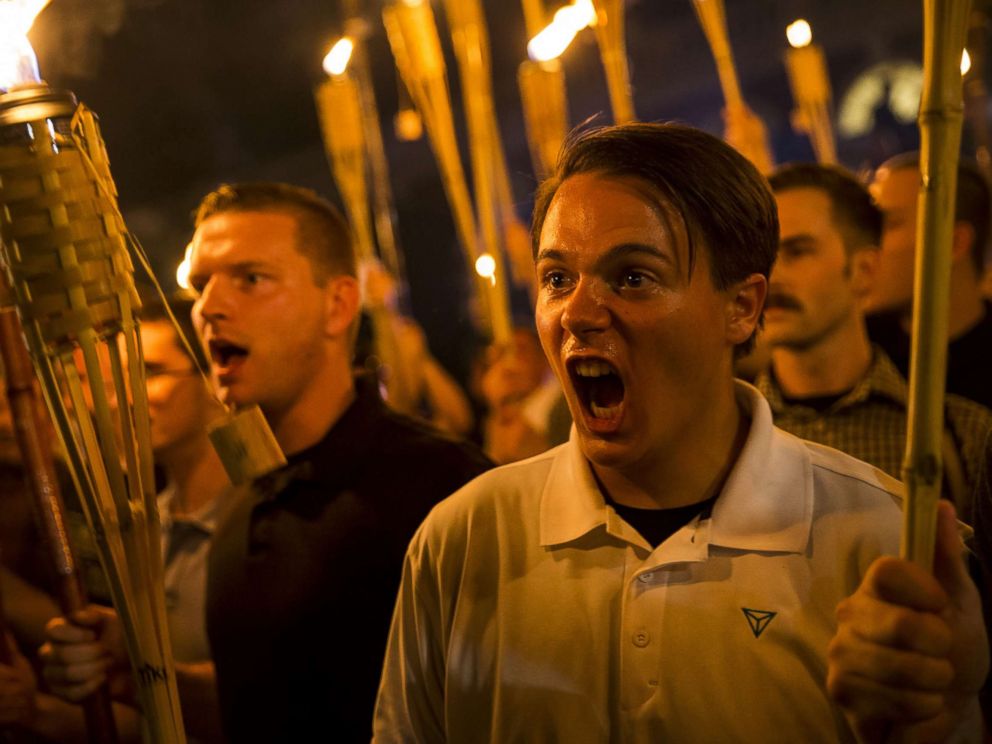 PHOTO: A group primarily composed of self-identified Neo Nazis, Alt-Right and White Supremacists chants at counter-protesters after marching through the UVA campus with torches in Charlottesville, Va., Aug. 11, 2017.