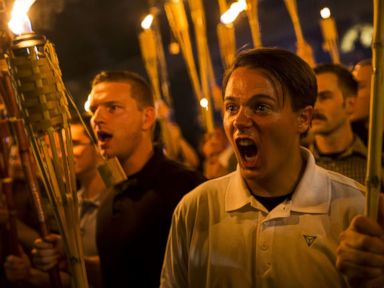 PHOTO: A group primarily composed of self-identified Neo Nazis, Alt-Right and White Supremacists chants at counter-protesters after marching through the UVA campus with torches in Charlottesville, Va., Aug. 11, 2017.