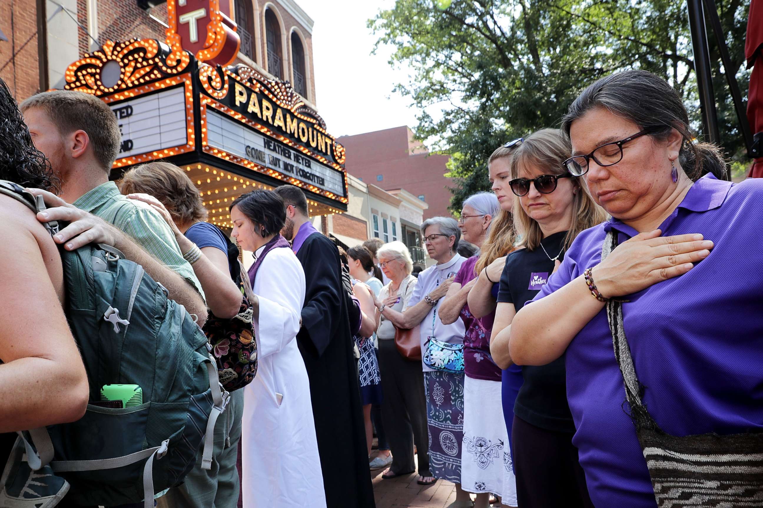 PHOTO: People observe a moment of silence during the memorial service for Heather Heyer outside the Paramount Theater, Aug. 16, 2017, in Charlottesville, Va.