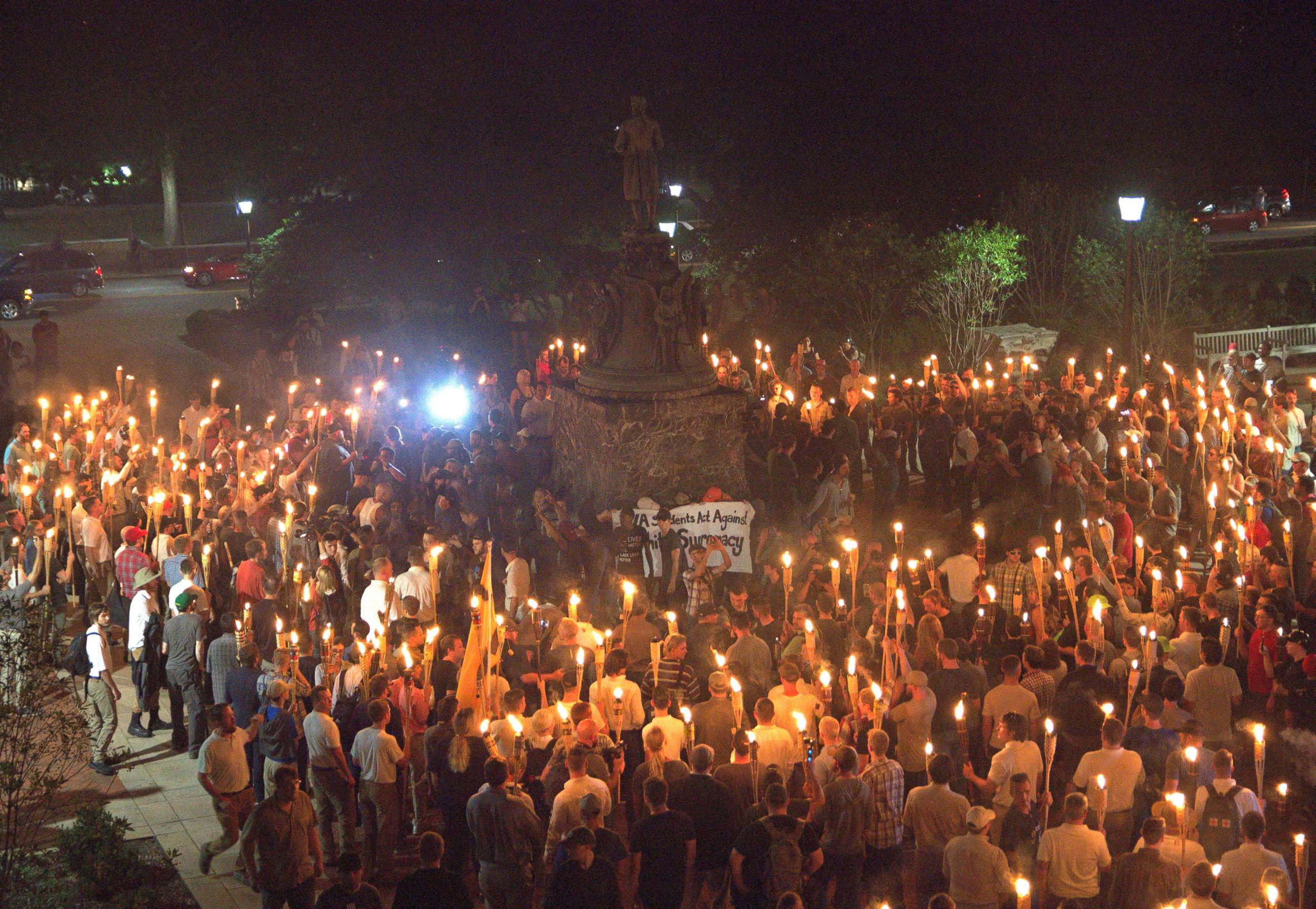 PHOTO: White nationalists carry torches around a statue of Thomas Jefferson on the grounds of the University of Virginia, on the eve of a planned Unite The Right rally in Charlottesville, Va., Aug. 11, 2017. 