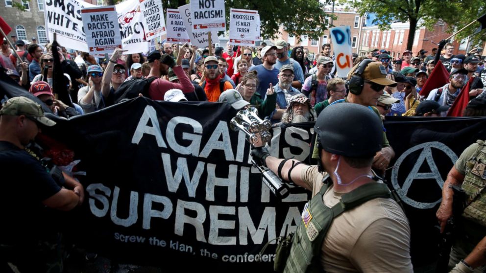 Members of white nationalists are met by a group of counter-protesters in Charlottesville, Va., Aug. 12, 2017. 