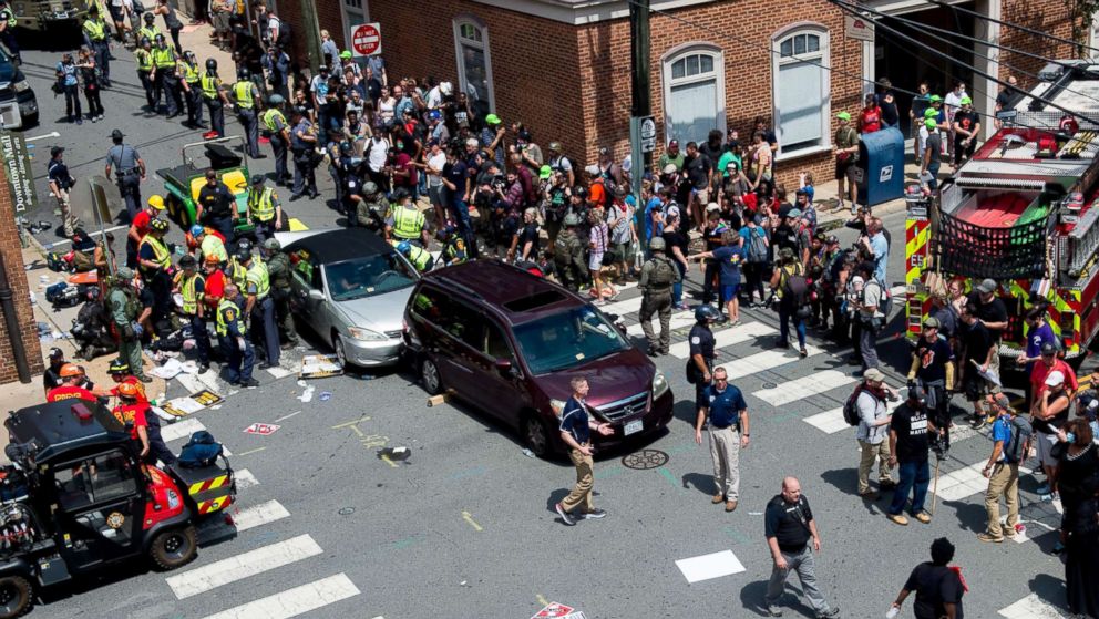 PHOTO: People receive first-aid after a car ran into a crowd of protesters in Charlottesville, Va., Aug. 12, 2017. 