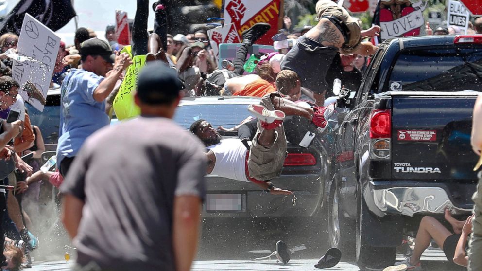 PHOTO: People fly into the air as a vehicle drives into a group of protesters demonstrating against a white nationalist rally in Charlottesville, Va., Aug. 12, 2017.