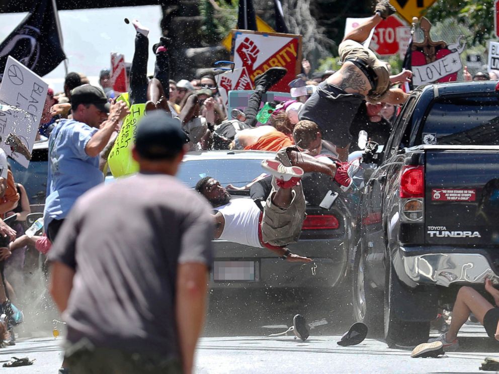 PHOTO: People fly into the air as a vehicle drives into a group of protesters demonstrating against a white nationalist rally in Charlottesville, Va., Aug. 12, 2017.
