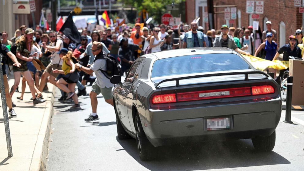 PHOTO: A vehicle drives into a group of protesters demonstrating against a white nationalist rally in Charlottesville, Va., Aug. 12, 2017. 