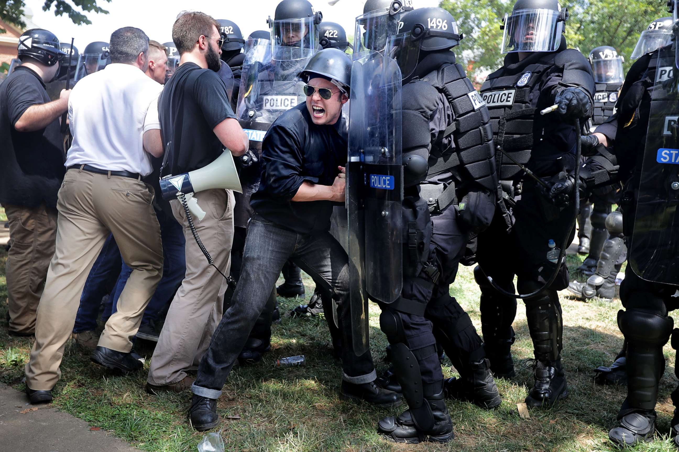 PHOTO: White nationalists, neo-Nazis and members of the "alt-right" clash with police as they are forced out of Lee Park after the Unite the Right rally was declared an unlawful gathering, Aug. 12, 2017 in Charlottesville, Va. 
