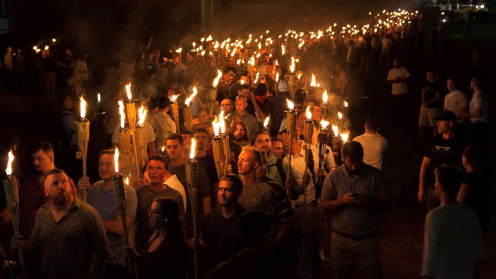 PHOTO: White nationalists carry torches on the grounds of the University of Virginia, on the eve of a planned Unite The Right rally in Charlottesville, Va., Aug. 11, 2017. 
