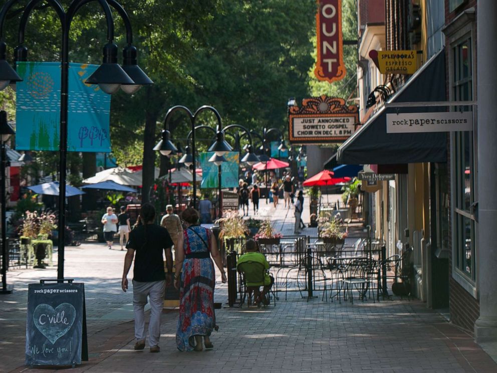 PHOTO: People walk down the open air mall in downtown Charlottesville, Va., Aug. 10, 2018.