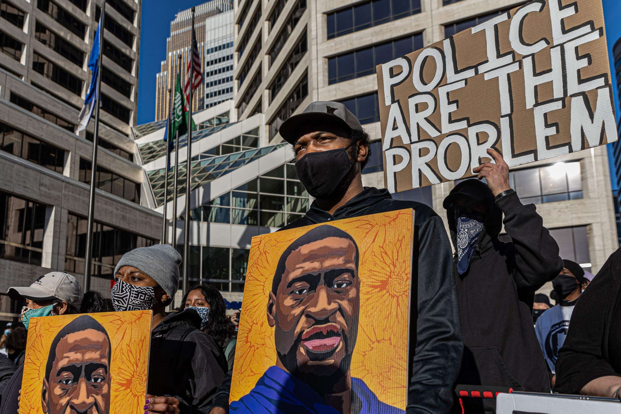 PHOTO: Demonstrators protest outside the Hennepin County Government Center before jury selection begins at the trial of former Minneapolis Police officer Derek Chauvin on March 8, 2021, in Minneapolis.