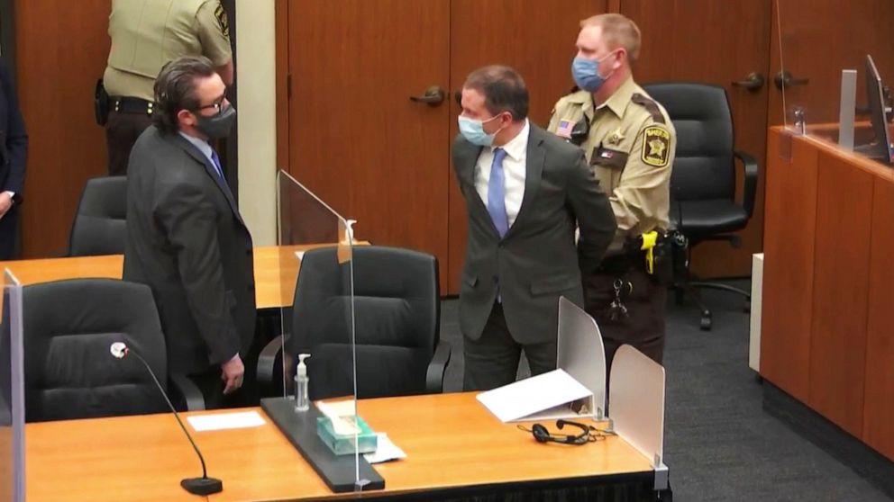 PHOTO: Former Minneapolis police Officer Derek Chauvin, center, is taken into custody after the verdicts were read at Chauvin's trial for the 2020 death of George Floyd, at the Hennepin County Courthouse in Minneapolis.