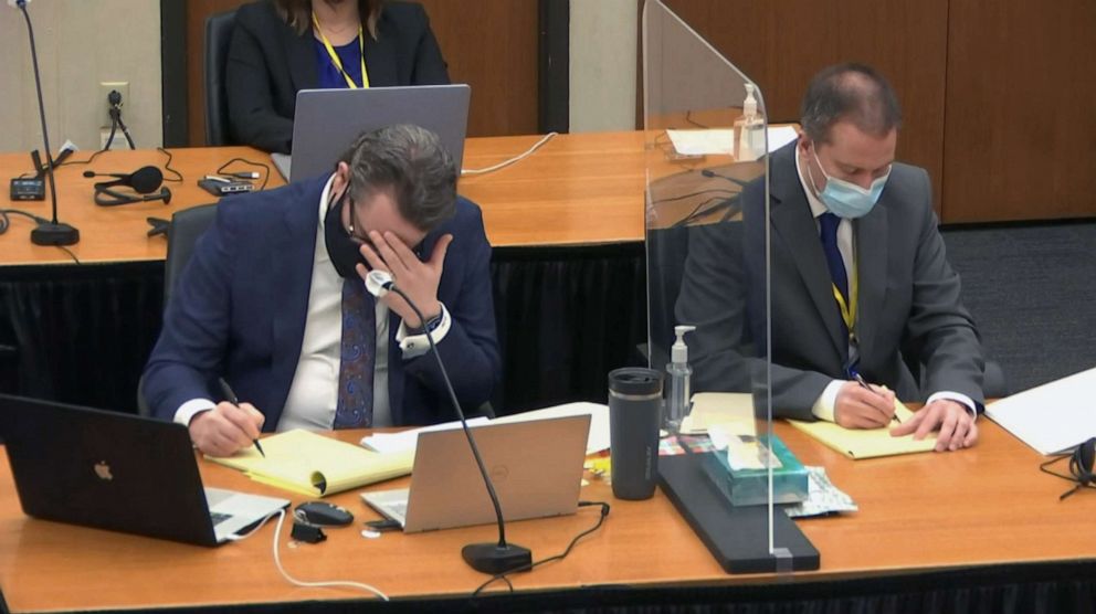 PHOTO: Defense attorney Eric Nelson, left, and defendant, former Minneapolis police officer Derek Chauvin, right, listen to testimony, April 12, 2021, during the trial at the Hennepin County Courthouse in Minneapolis.