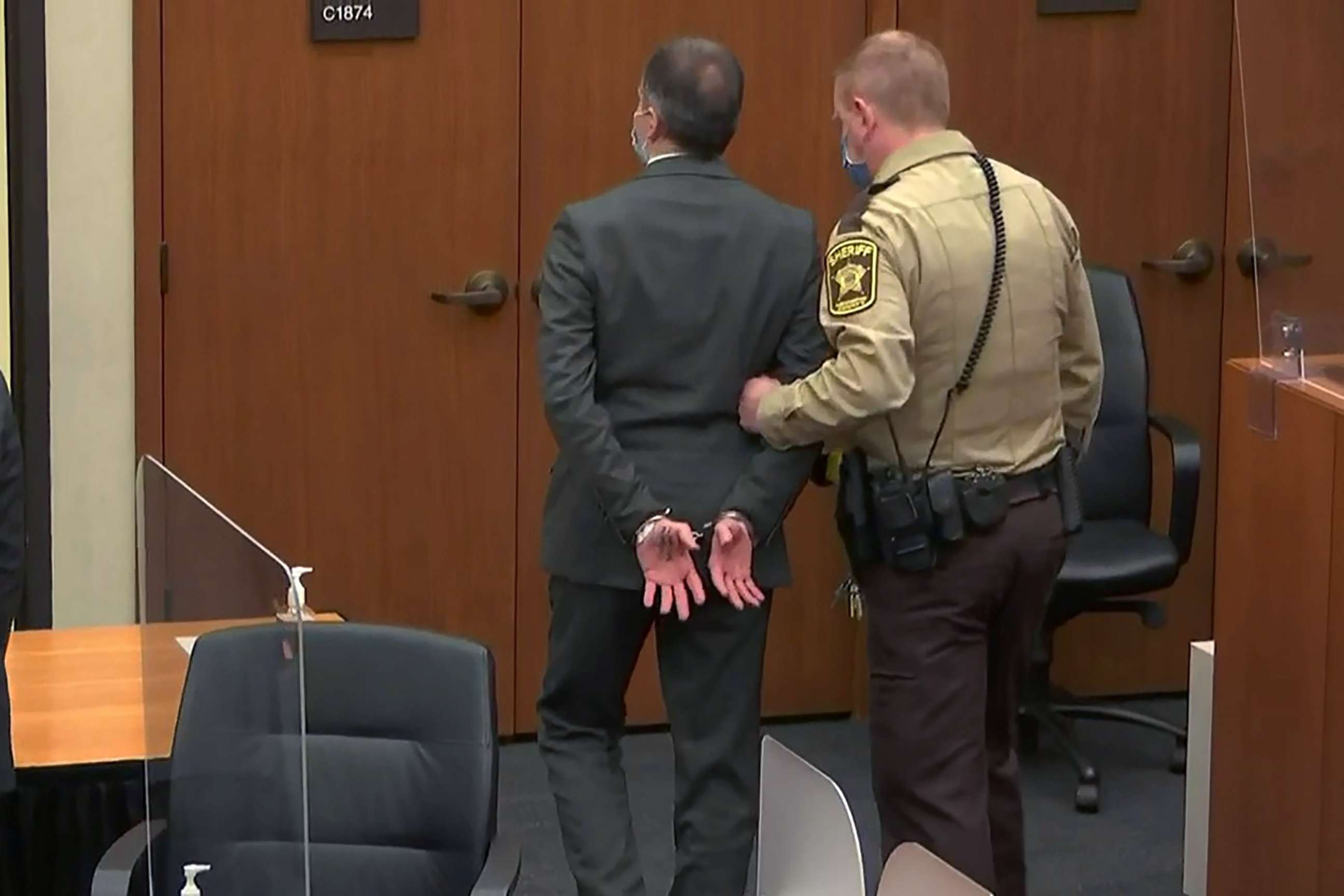 PHOTO: Former Minneapolis police officer Derek Chauvin is led away in handcuffs after a jury found him guilty of all charges in his trial in the death of George Floyd in Minneapolis, April 20, 2021.